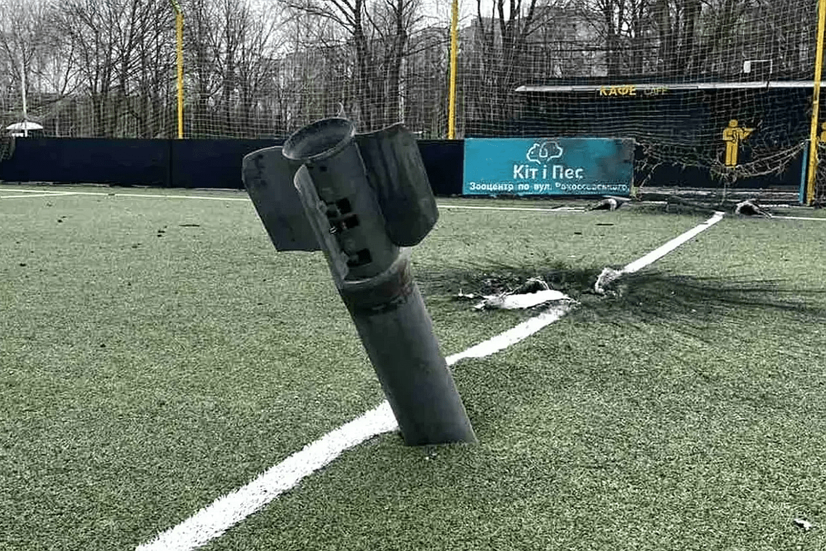 Missile fragment embedded in a damaged artificial turf field in Ukraine.